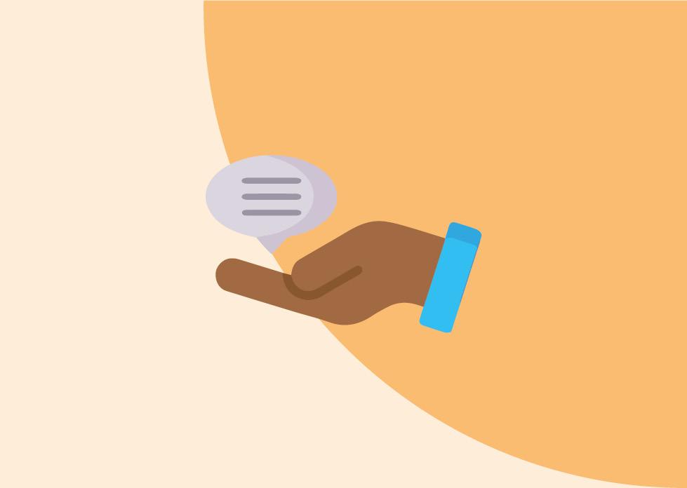 a hand holding a speech bubble