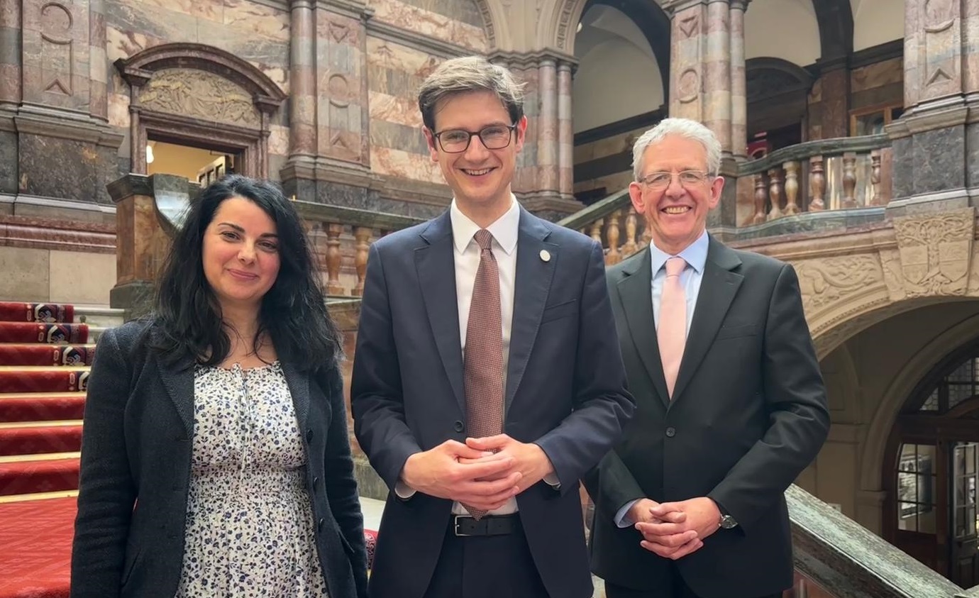 The three party leaders smile on the brightly lit main staircase at Sheffield Town Hall. From left, Cllr Angela Argenzio from the Green Group, Cllr Tom Hunt of the Labour Group, also the Leader of the Council, and Cllr Martin Smith of the Liberal Democrat Group