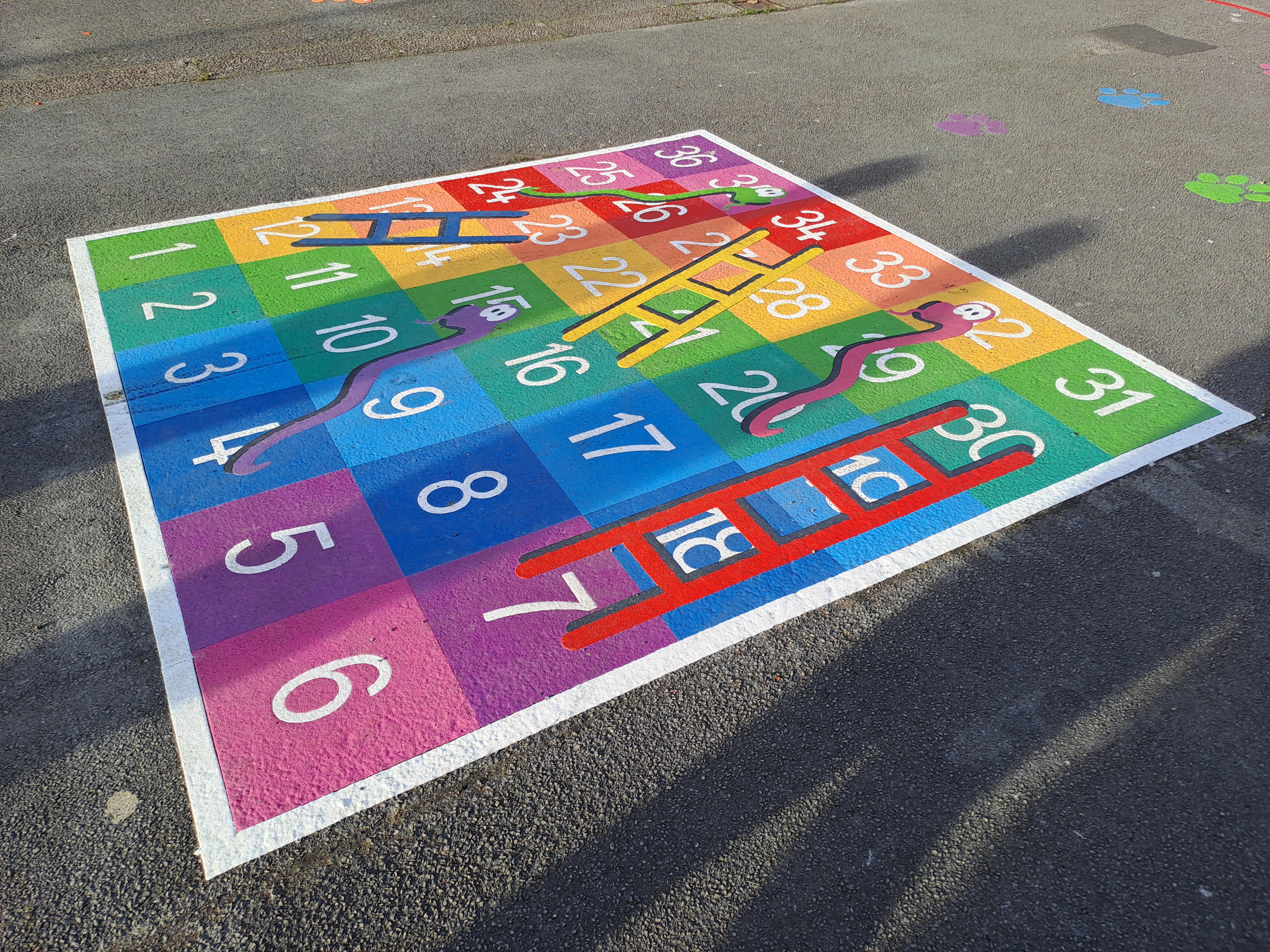 A brightly coloured snakes and ladders 'play marker' at The Gaunt shopping precinct in Gleadless Valley