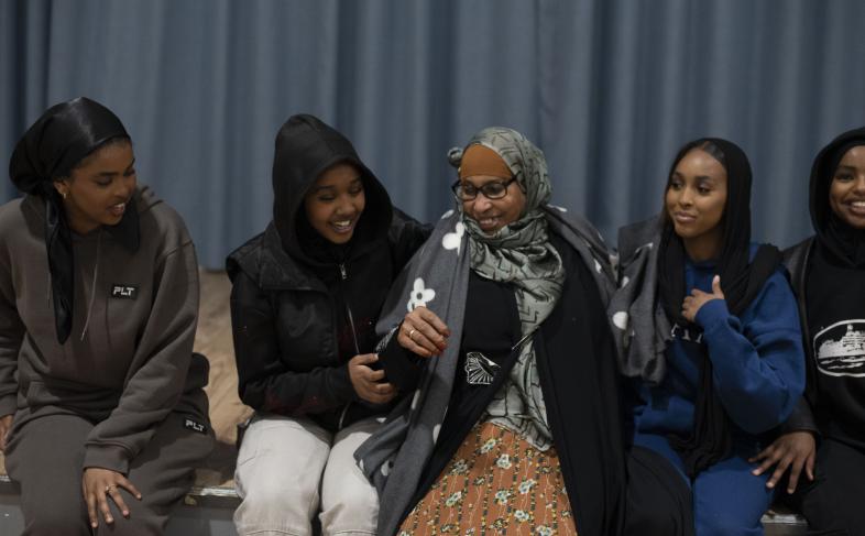 A group of people chatting happily at an Irise event