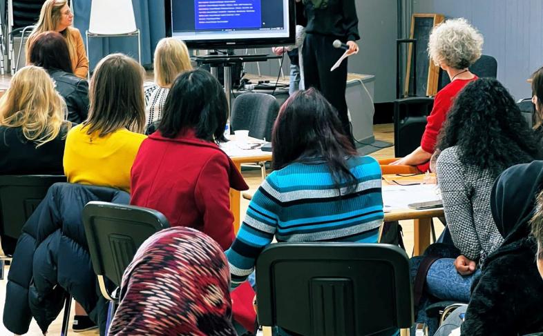 A group of people watching a presentation at an Opportunity Sheffield event