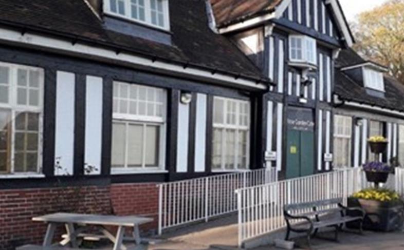 Front of the Rose Garden cafe Graves Park. A black and white tudor style building