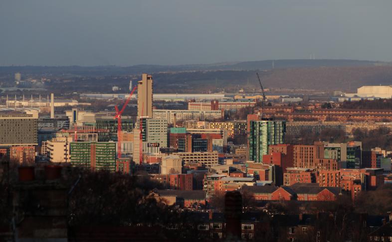 High rise buildings in Sheffield City Centre with rolling hills in the background
