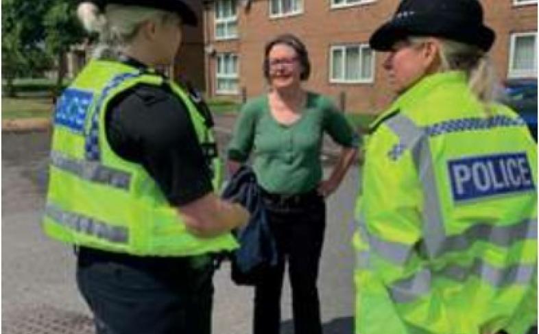 Cllr Alison Norris speaks to two police officers
