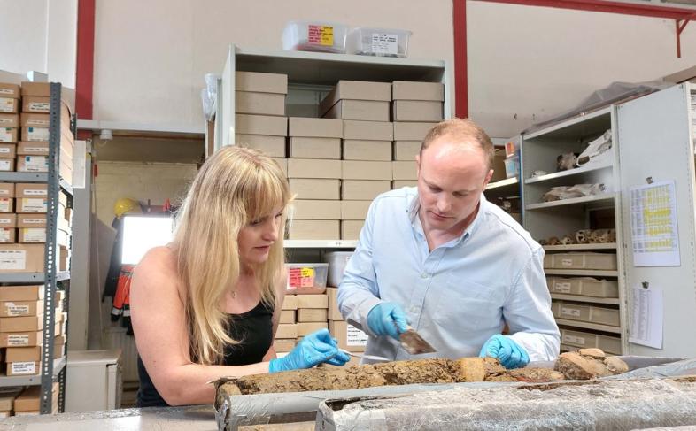 Archaeologist and Digging for Britain presenter Dr Cat Jarman with Dr Daniel Young from Wessex Archaeology examining the Sheffield Castle core samples at the Wessex Archaeology labs
