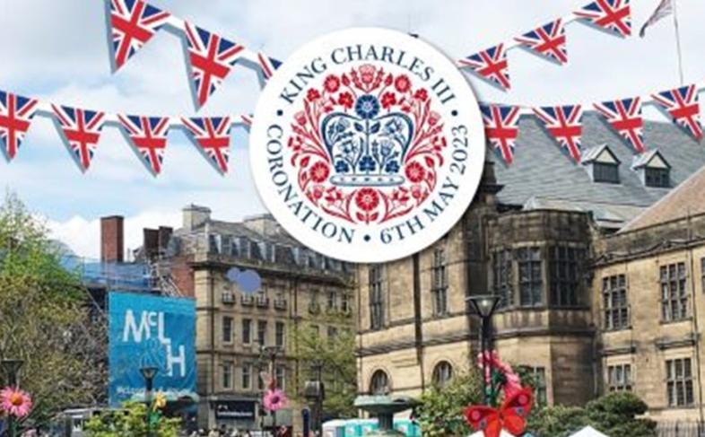 Picture of Sheffield Town Hall in the background with the Peace Gardens in the foreground with computer generated bunting at the top of the picture and the King's Coronation logo in the middle of the bunting
