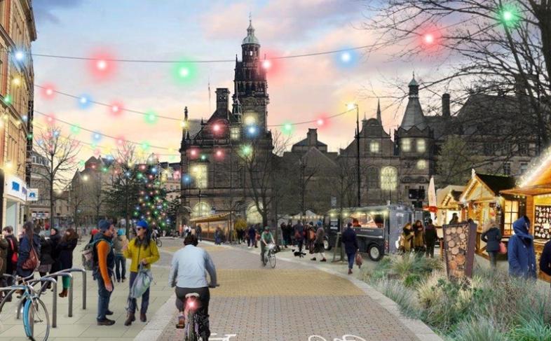 A computer generated picture showing a pedestrianised Pinstone Street with Christmas lights across the picture and Sheffield Town Hall in the background