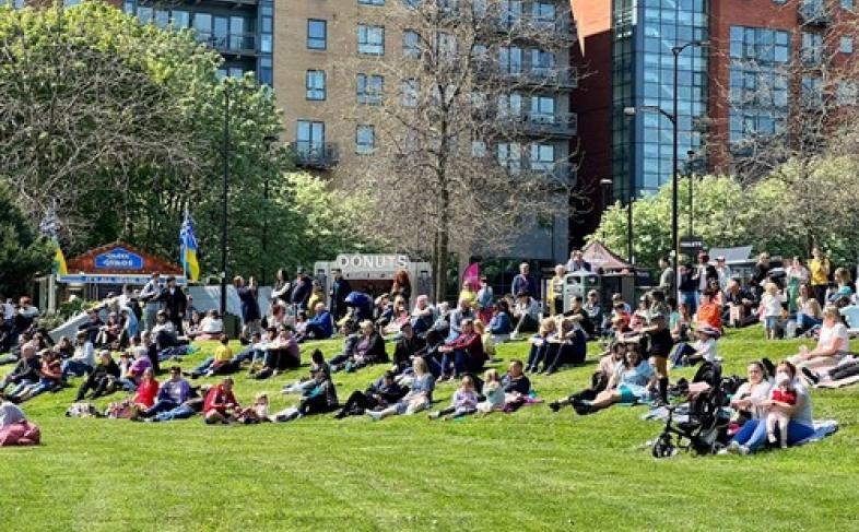 People sit on grass