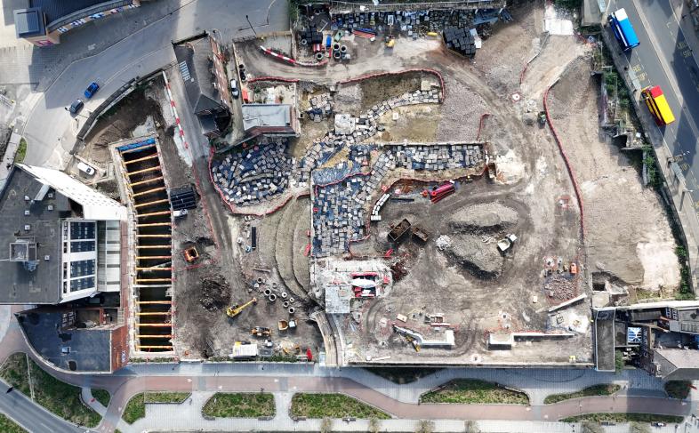 An aerial view of the Castlegate site shows work progressing. Work on the excavation of the castle can be seen, as well as the de-culverting of the River Sheaf
