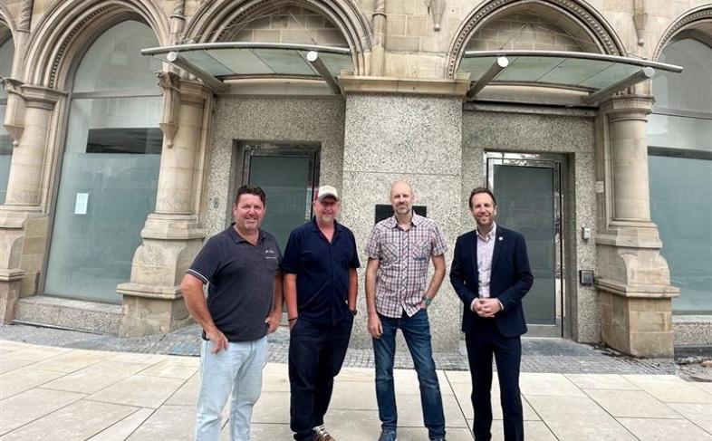 Cllr Ben Miskell and representatives of Thornbridge & Co outside what will be The Fargate pub on Fargate, but what is currently an empty building