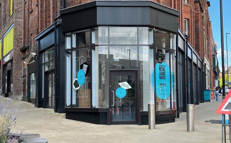 Picture shows the front of the a shop unit located on the corner of two streets