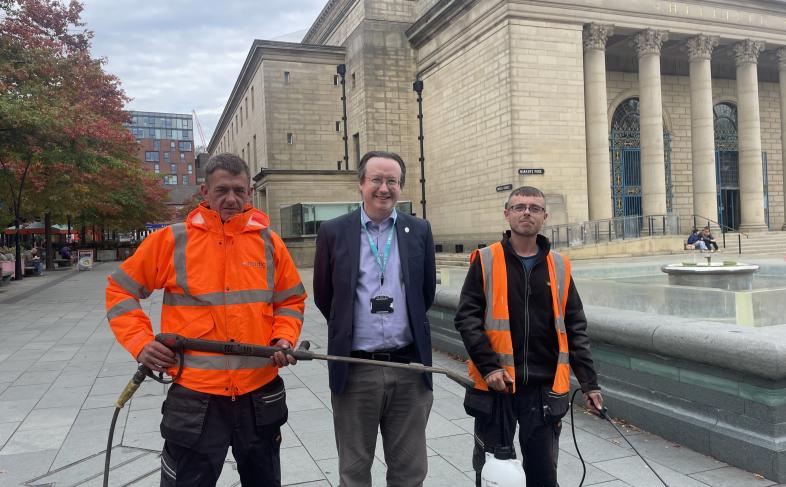 Cllr Joe Otten with operatives from Nordic Products and Services Ltd who are cleaning some city pavements of chewing gum
