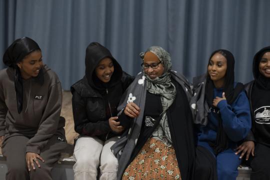 A group of people chatting happily at an Irise event