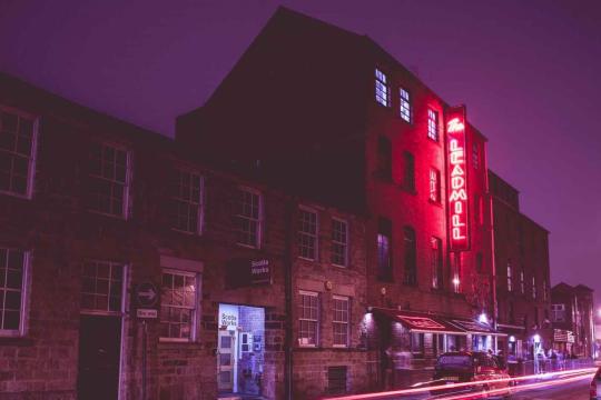 The Leadmill at night, lit up by a red neon light with the name of the venue