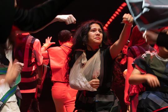 Young people on stage performing 