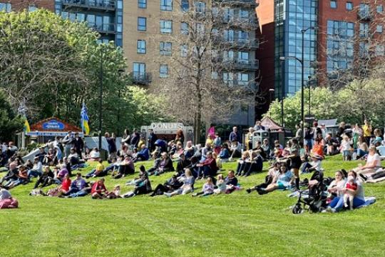 People sit on grass