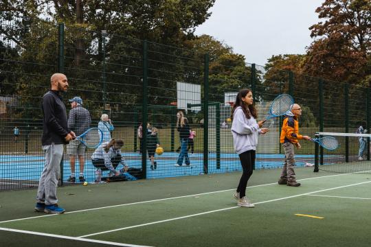 People enjoying tennis at the courts 