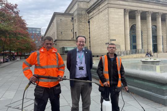Cllr Joe Otten with operatives from Nordic Products and Services Ltd who are cleaning some city pavements of chewing gum
