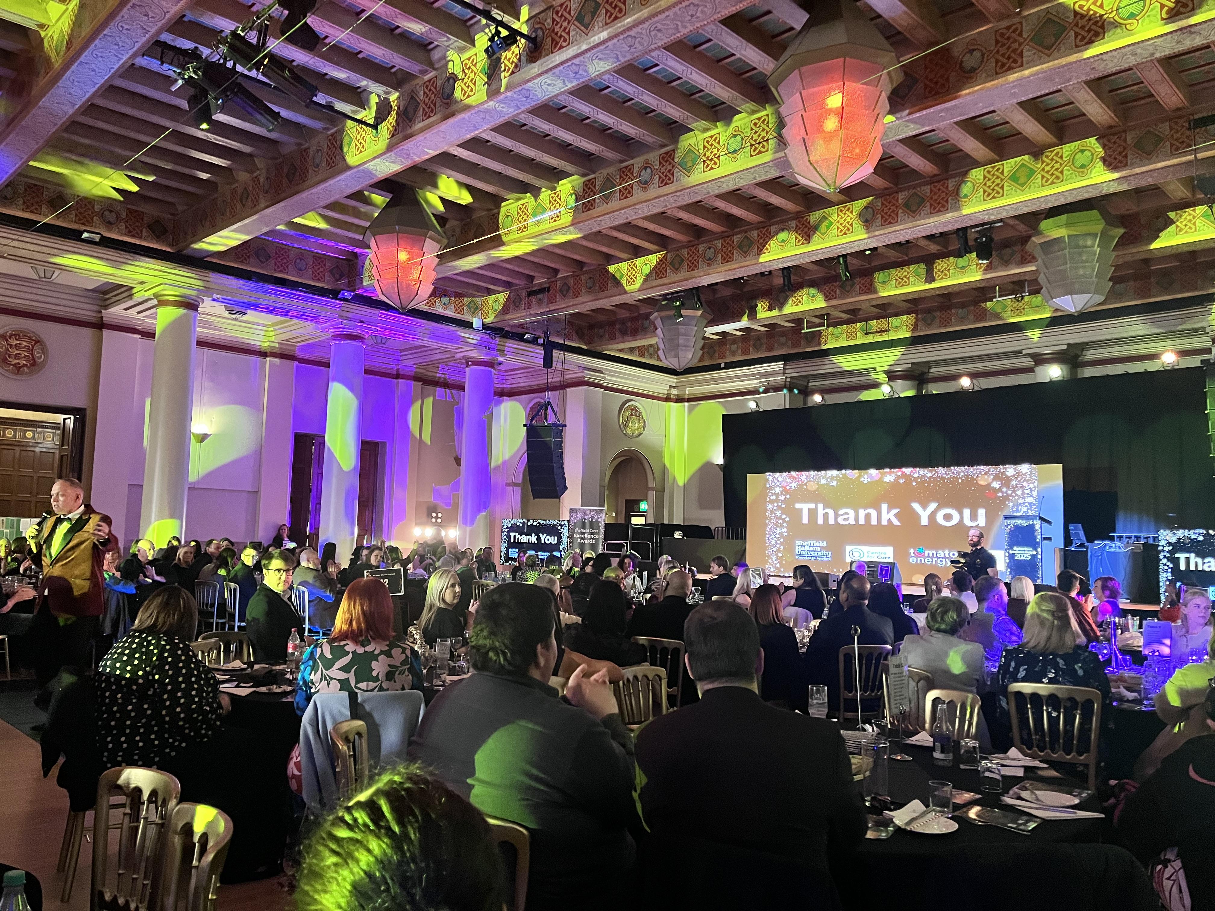 Photo of Sheffield Cares Awards night at Sheffield City Hall Ballroom with several people by tables